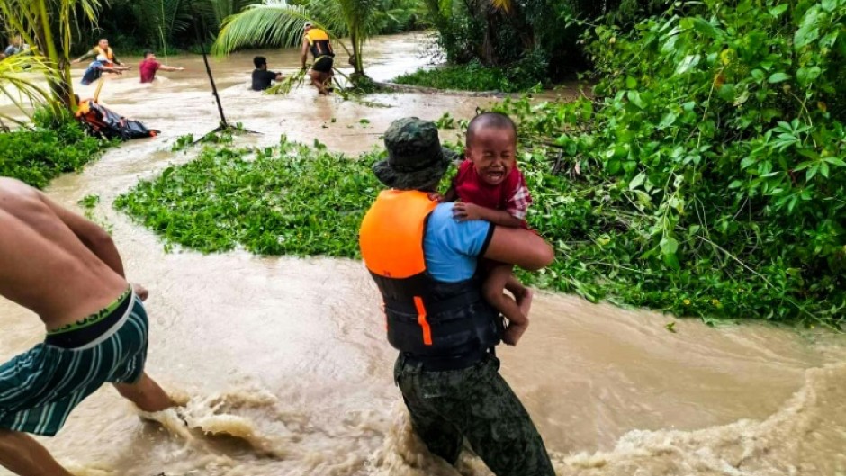 Tropical Storm Nalgae has unleashed flash floods and landslides in parts of the Philippines