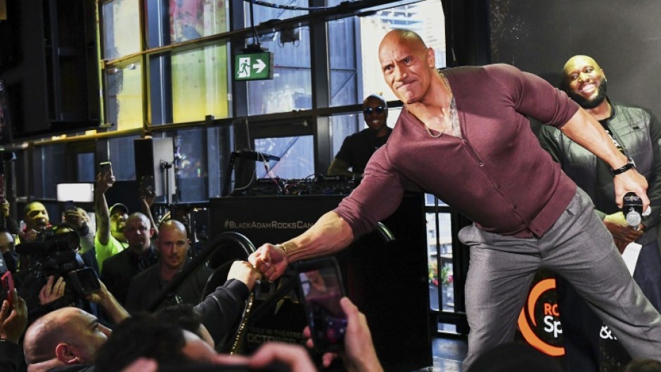 Dwayne Johnson, the star of superhero film "Black Adam," greets fans at an event October 13, 2022 in Toronto, Ontario, Canada 