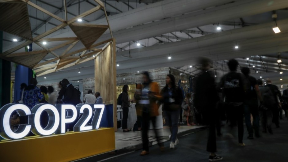 Participants walk inside the Sharm el-Sheikh International Convention Centre during the COP27 climate conference