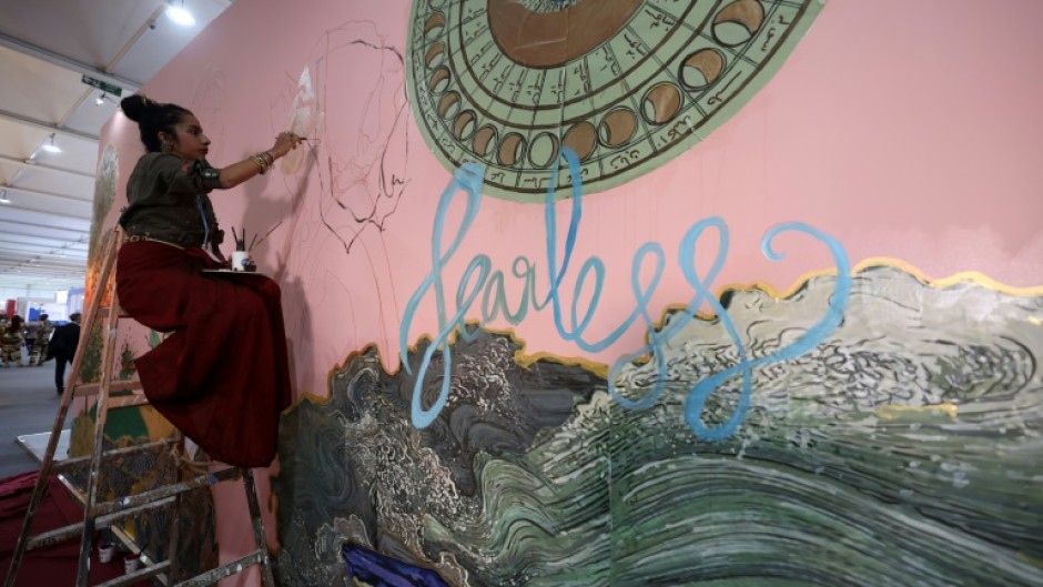 Award-winning Indian artist Shilo Shiv Suleman painted a mural called "fearless" at the youth pavillon, during the COP27 climate summit in the Red Sea resort of Sharm el-Sheikh