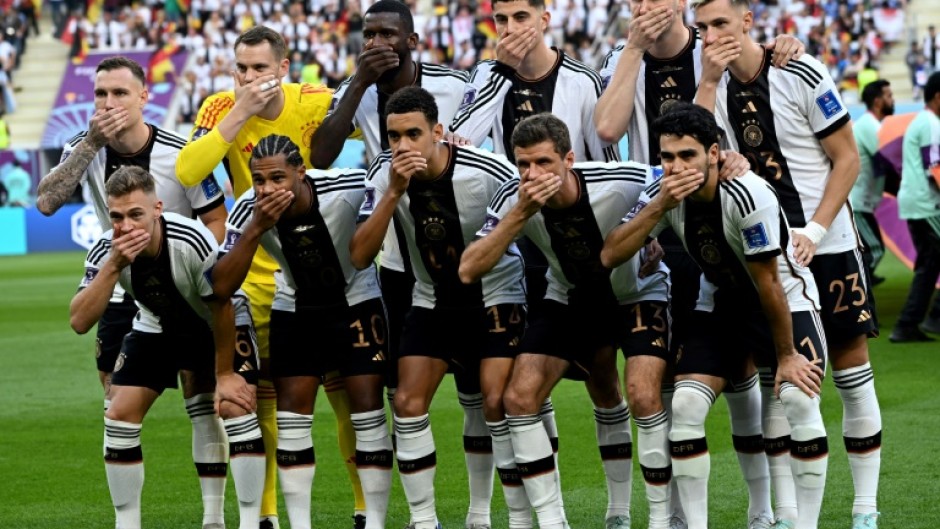 The German players covered their mouths in protest at FIFA's stance on a rainbow-themed armband