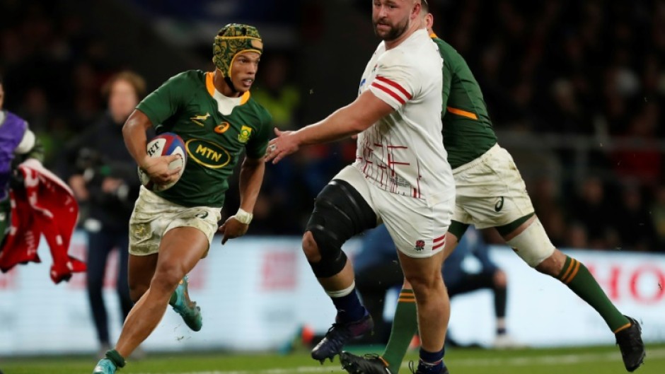 Try-scorer - South Africa wing Kurt-Lee Arendse (L) on the attack against England at Twickenham