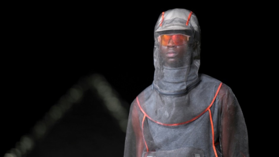 A model presents a creation at Dior fashion show at the Giza Pyramids on December 3