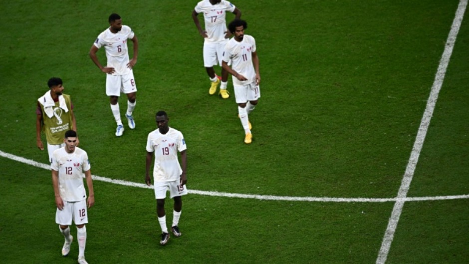 Qatar's players react at the end of their defeat to the Netherlands on Tuesday