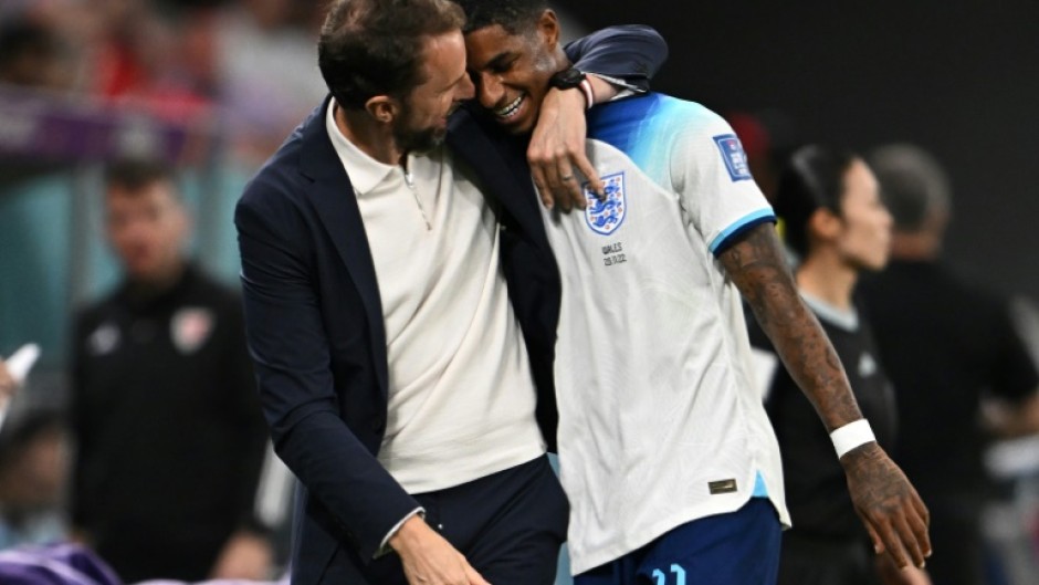 England manager Gareth Southgate hugs Marcus Rashford