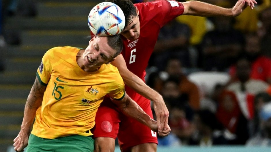 Australia's Mitchell Duke fights for the ball with Denmark defender Andreas Christensen