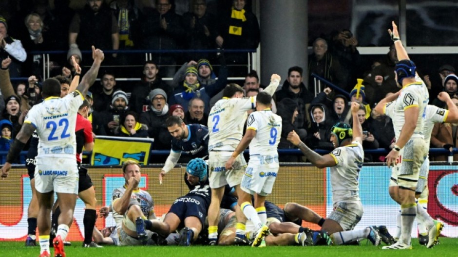 Clermont celebrate Loic Godener's try against Montpellier