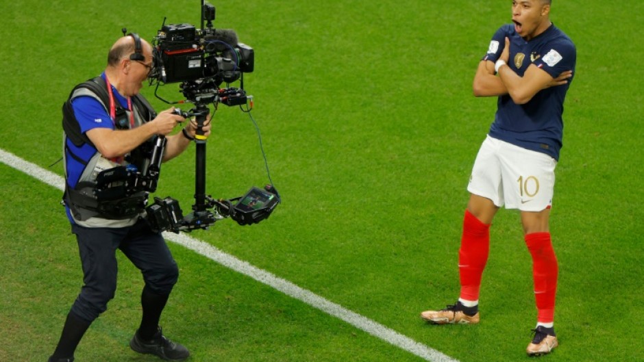 Kylian Mbappe celebrates after scoring in France's win over Poland on Sunday