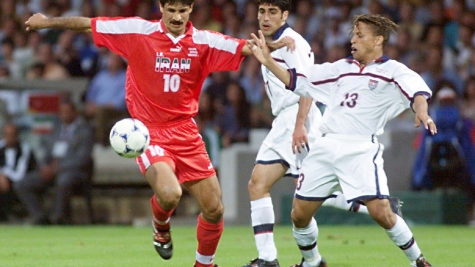 Iranian forward Ali Daei (L) fights for the ball with US midfielder Cobi Jones (R) during their 1998 World Cup clash