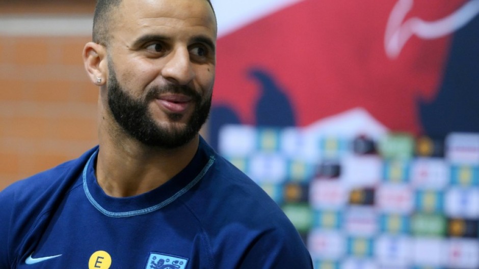 England defender Kyle Walker plays darts against a journalist at the team's World Cup training camp