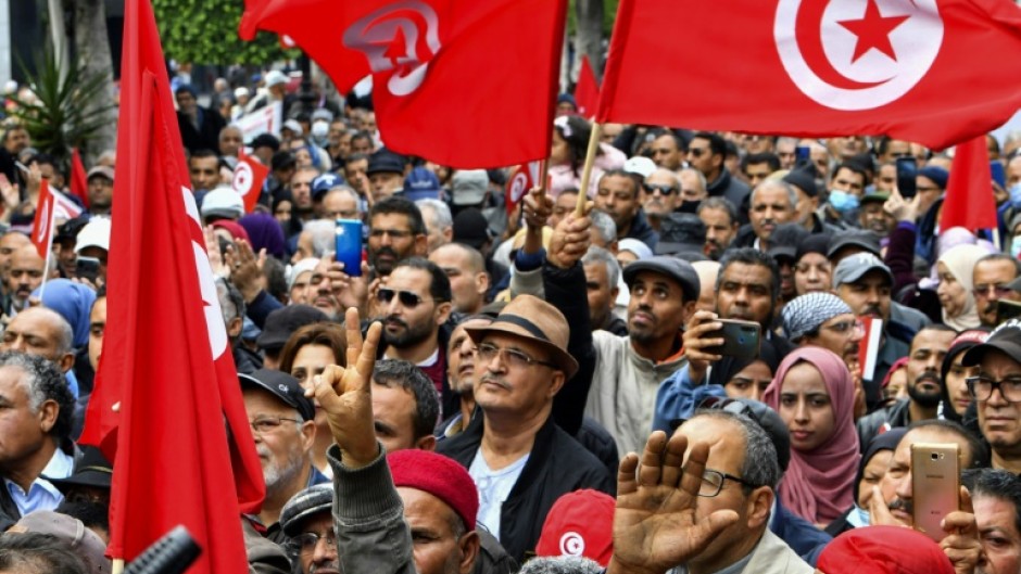 Tunisian demonstrators take part in a rally against President Kais Saied in the capital Tunis