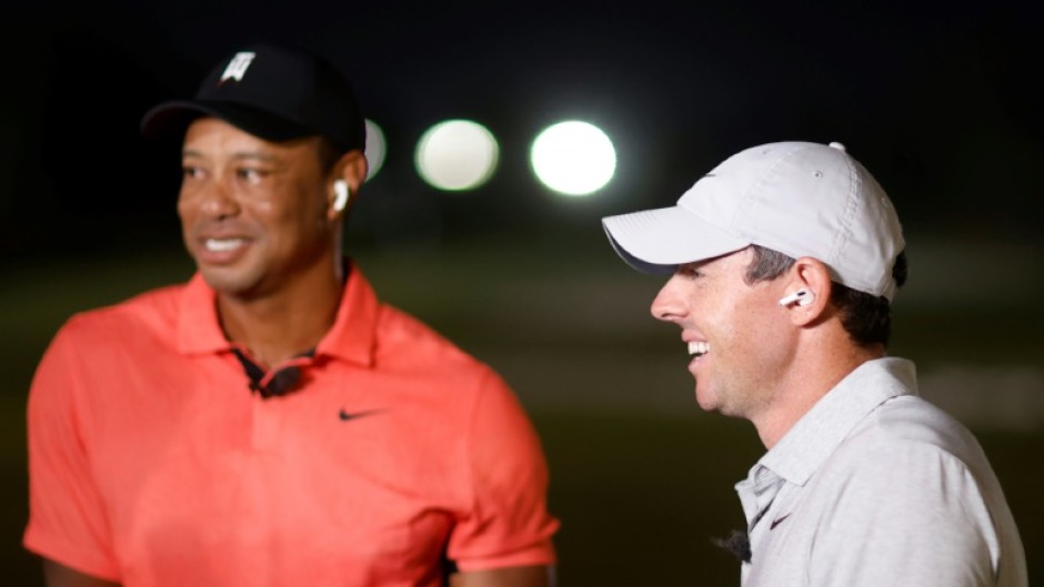 Tiger Woods, left, and top-ranked Rory McIlroy laugh during The Match, which they lost to Justin Thomas and Jordan Spieth 