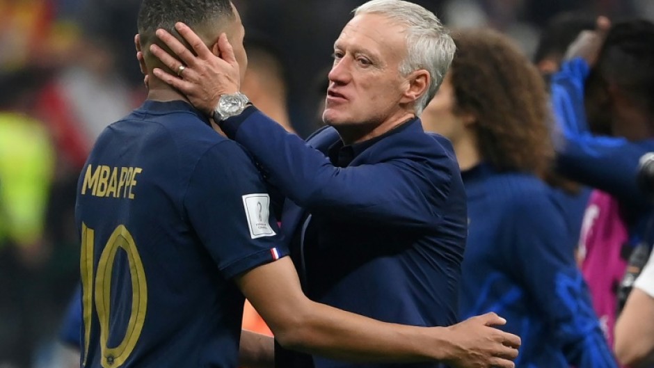 France coach Didier Deschamps embraces Kylian Mbappe after his side beat Morocco to reach the World Cup final