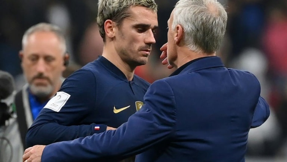 Antoine Griezmann embraces France coach Didier Deschamps after the holders beat Morocco to return to the World Cup final