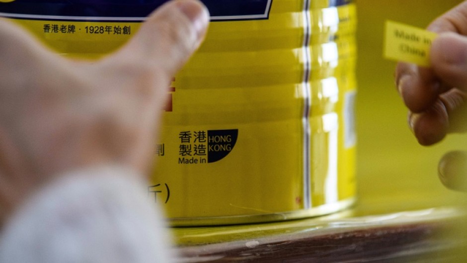 A Hong Kong factory replaces a 'Made in Hong Kong' label in 2020 after the US said goods produced in the city must be marked 'Made in China'