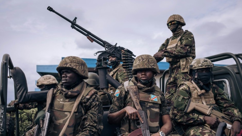 On guard: Kenyan and Congolese troops at Goma airport in eastern DR Congo in mid-November