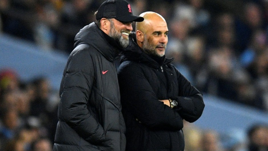 Rival bosses - Liverpool manager Jurgen Klopp (L) and Manchester City counterpart Pep Guardiola on the Etihad touchline