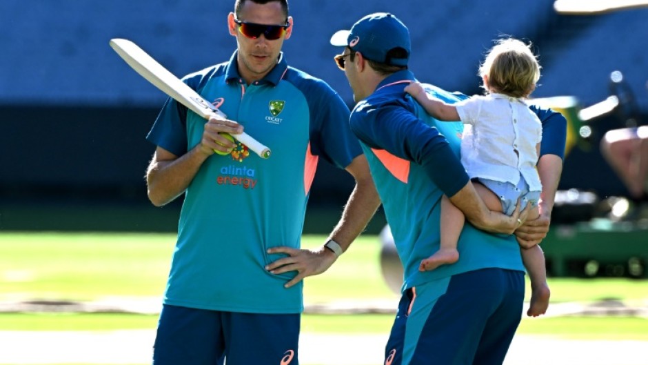 Seamer Scott Boland (L, with captain Pat Cummins) is assured of another game at the MCG, where he took an incredible 6-7 on debut against England a year ago