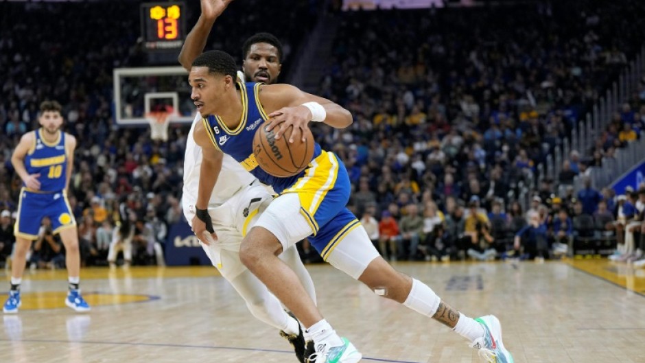 Golden State's Jordan Poole drives to the basket past Utah's Malik Beasley in the Warriors' 112-107 NBA victory over the Jazz