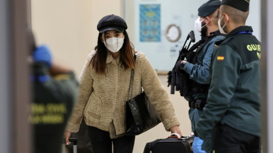 Passengers on the Air China CA 907 flight to Spain had to undergo a series of health controls after rules were imposed on visitors from China