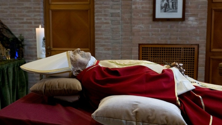 This handout photograph released on January 1, 2023 by the Vatican press office shows the body of Pope Emeritus Benedict XVI