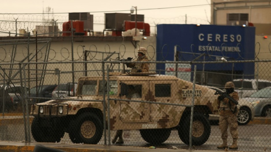 Members of the Mexican Army secure an area outside the Ciudad Juarez number 3 state prison on January 2, 2023