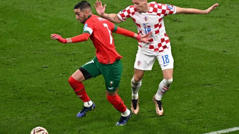 Morocco star Hakim Ziyech (L) playing against Croatia in the World Cup third-place playoff in Qatar on December 17, 2022.