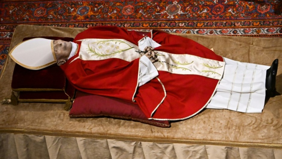 Catholic worshippers pay their respects to former pope Benedict XVI at Myeongdong Cathedral in Seoul on January 4, 2023