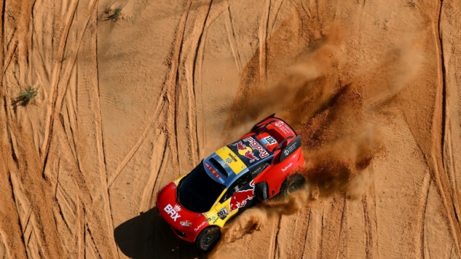French rally great Sebastien Loeb lost further ground on overall leader and defending champion Nasser Al-Attiyah after rolling his car during the fifth stage