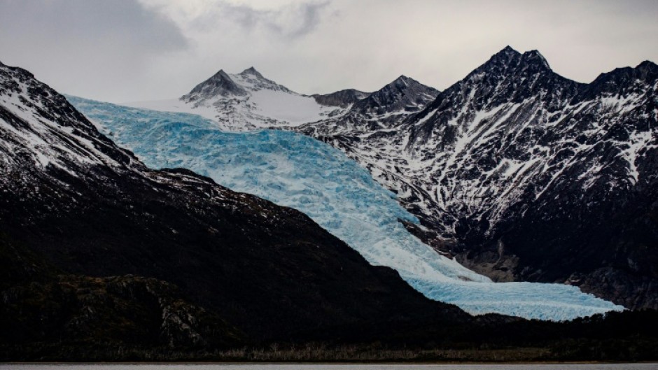 A glacier stretches over the Darwin Mountain Range in the Magallanes region of southern Chile, seen in September 2022
