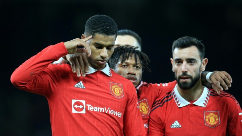Marcus Rashford (left) celebrates with teammates after scoring Manchester United's third goal in their 3-1 win against Everton