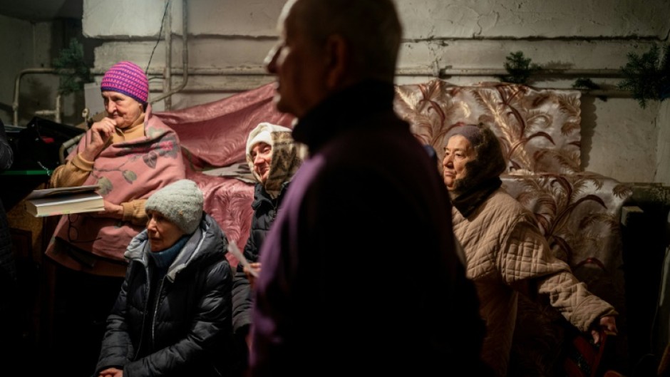 During a two-hour service, worshippers did their best to tune out the war
