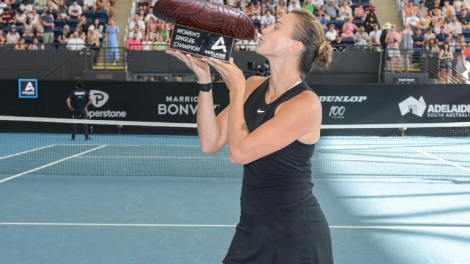 Aryna Sabalenka holds the trophy after winning the Adelaide International 