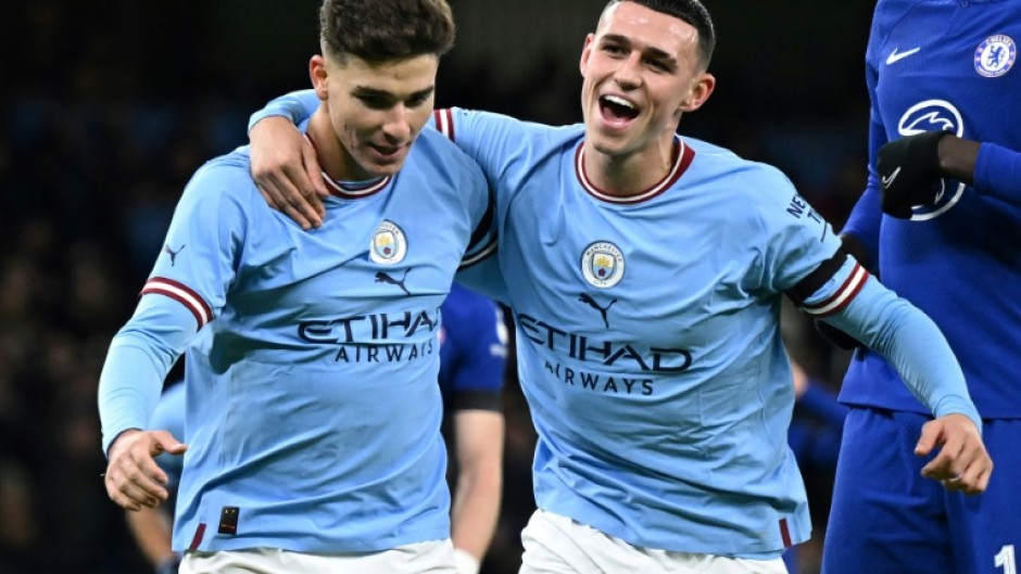 Manchester City's Julian Alvarez (L) celebrates with  Phil Foden