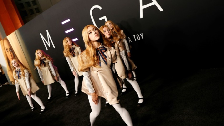 Models dressed as the scary android doll in Universal's horror film 'M3GAN' appeared on the red carpet at the premiere in Hollywood, California