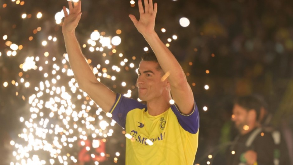 Al-Nassr's new forward Cristiano Ronaldo greets the fans during his unveiling at the Mrsool Park Stadium in the Saudi capital Riyadh on January 3, 2023