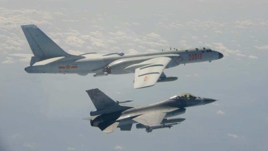 A Taiwanese F-16 fighter jet flying next to a Chinese H-6 bomber (top) in Taiwan's airspace