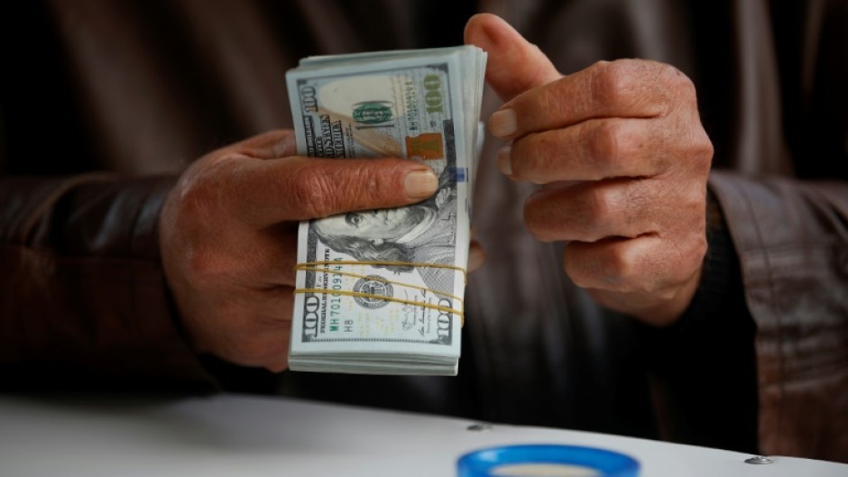 Some Iraqi officials have placed the blame for the dinar's woes squarely on the shoulders of one actor -- the United States