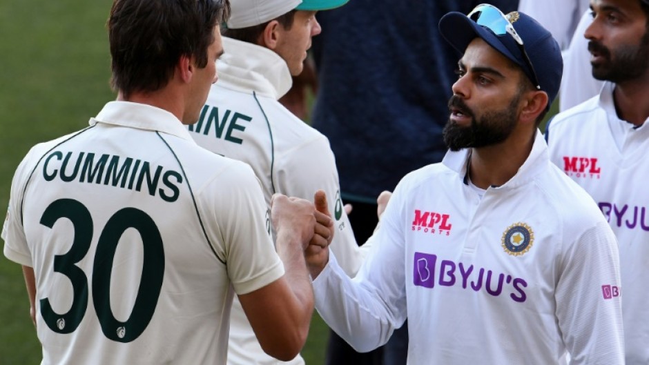 India's Virat Kohli congratulates Australia's Pat Cummins after the two sides met in a Test in December 2020 in Adelaide