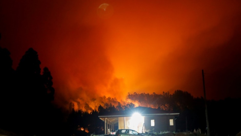 Raging forest fires light up night skies over Santa Juana, Chile on February 3, 2023; it is one of the cities hardest-hit by a series of fires amid scorching temperatures
