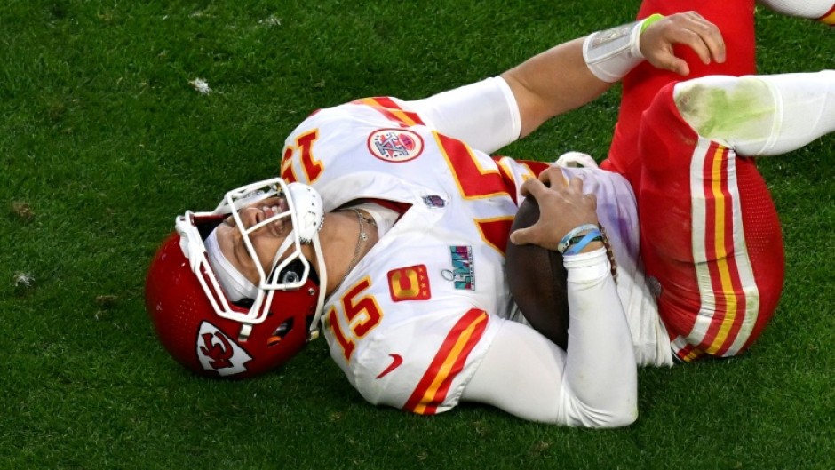 Kansas City quarterback Patrick Mahomes lay on the field in pain after aggravating an ankle injury during the Super Bowl but returned to lead the Chiefs to victory over Philadelphia