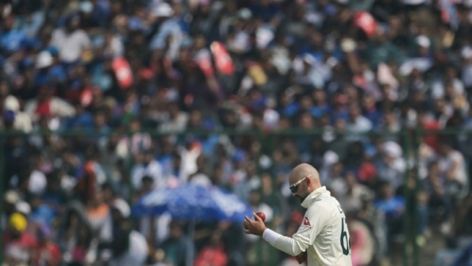 Australia's Nathan Lyon prepares to bowl during the second day of the second Test between India and Australia on February 18