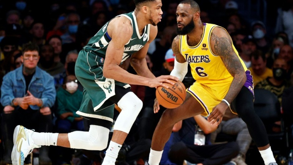NBA All-Star Game captains Giannis Antetokounmpo, left, and LeBron James, right, missed events on the eve of the annual showdown of elite talent