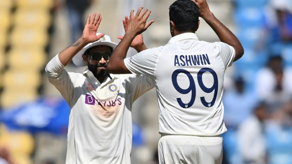 India's Ravichandran Ashwin (right) celebrates an Australian wicket with Ravindra Jadeja