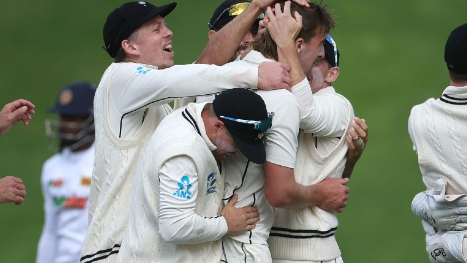 New Zealand players celebrate the wicket of Sri Lanka's Nishan Madushka on their way to winning the second Test on Monday in Wellington