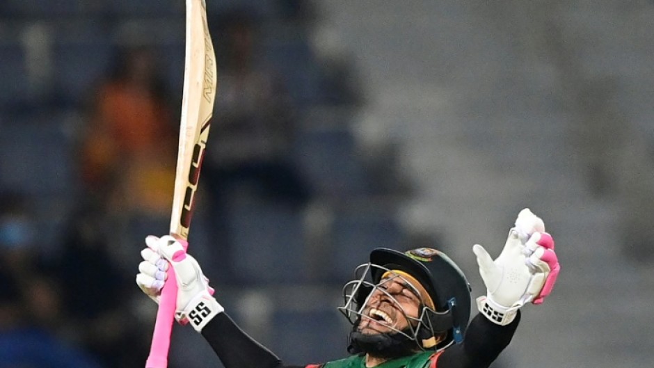 Bangladesh batsman Mushfiqur Rahim  celebrates after scoring a century in the second one-day international against Ireland in Sylhet. The home side made 349-6, their highest ODI score, but the match was called off because of rain