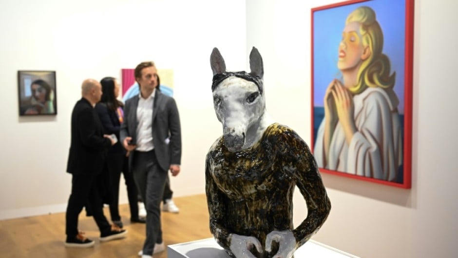 Visitors look at "Horse With A Heart" by Czech artist Klara Kristalova at Hong Kong's Art Basel