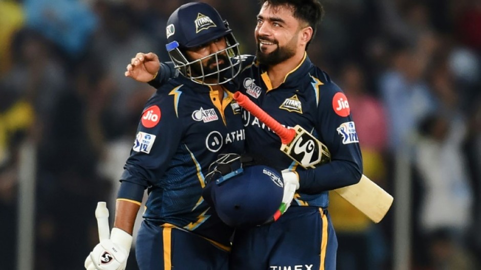 Winning moment: Gujarat Titans' Rahul Tewatia (left) and Rashid Khan celebrate victory