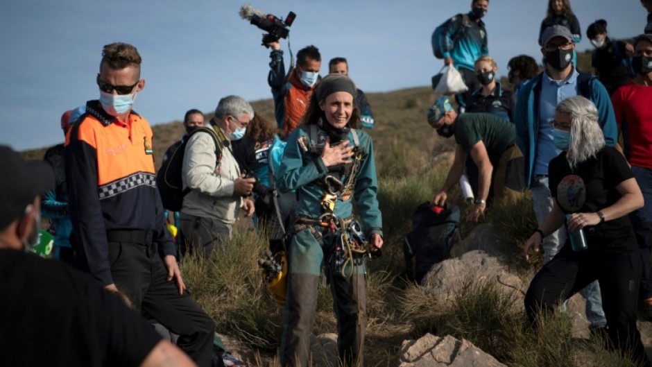 Spanish athlete Beatriz Flamini emerges from a cave after spending 500 days inside 