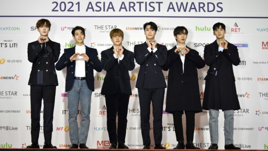 K-pop star Moobin (3rd from right), seen here with his band Astro in 2021, has died at the age of 25